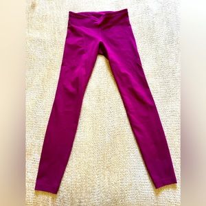 Under Armour women’s leggings, size small. Magenta color, full length.